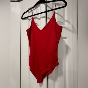 Red body suit -